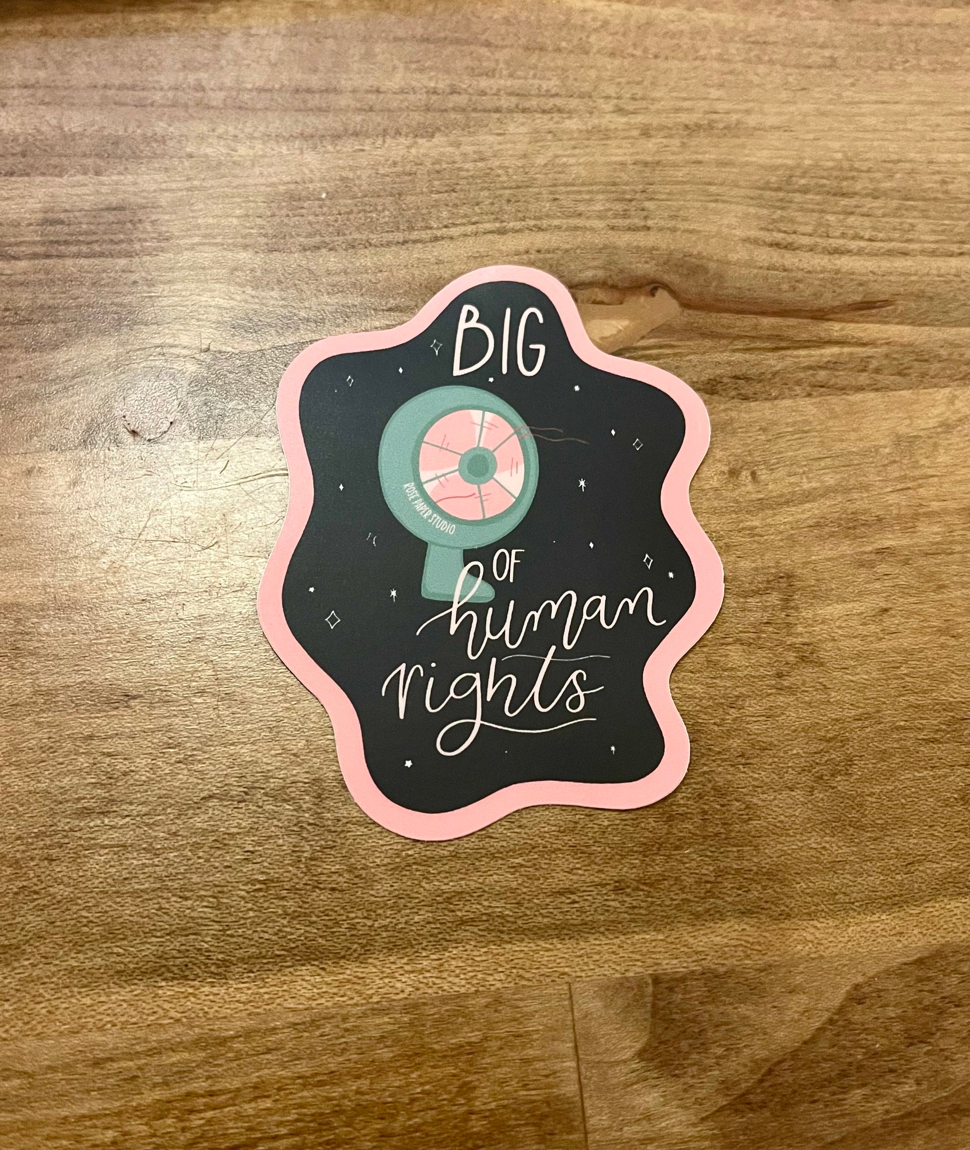 Retro activist sticker with hand drawn table fan illustration and the text "Big fan of human rights."